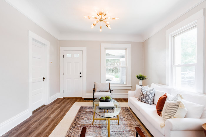 Bright, transitional living room with white couch favorite stage