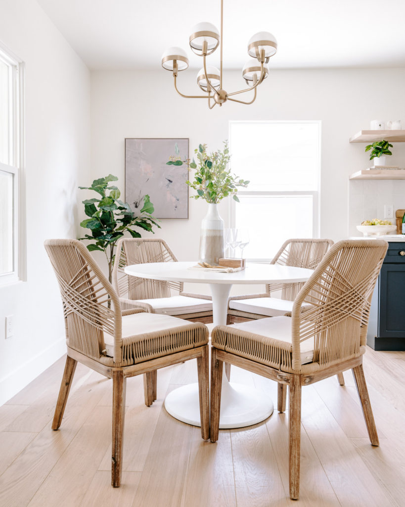 Woven dining chairs, white tulip dining table, accent greenery, modern dining. Home refresh and decorating tips 